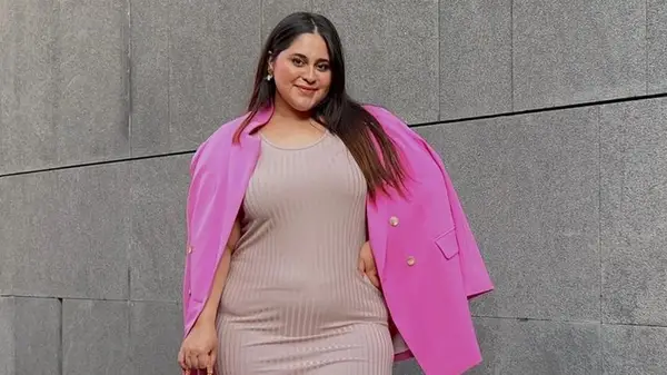 Woman wearing pink blazer