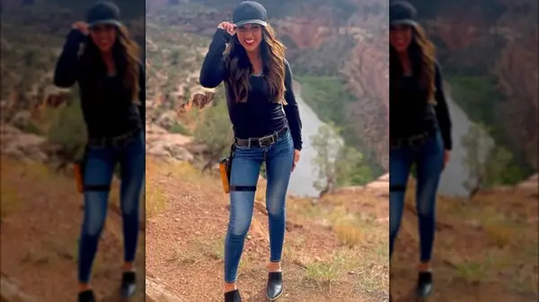 Lauren Boebert in skinny jeans and with a gun strapped to her thigh
