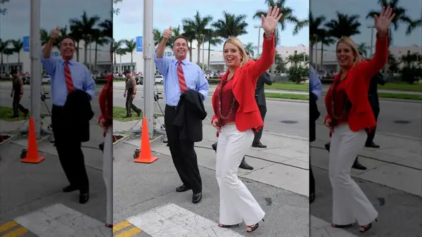 Pam Bondi in a red top and white pants