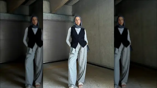 woman with black vest