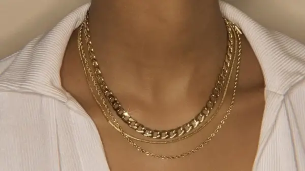 Woman with layered silver necklaces