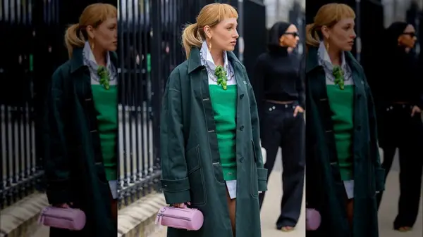 Woman holding a colorful handbag 