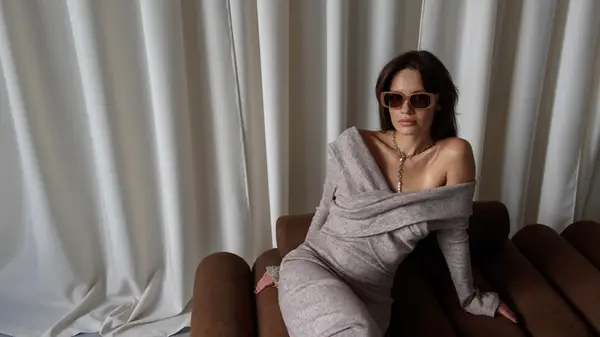 Woman wearing gray outfit