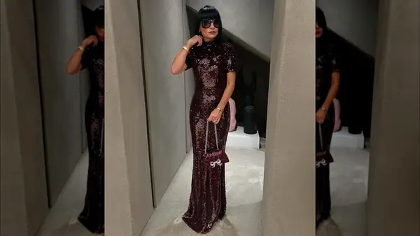 Woman in oxblood sequin dress