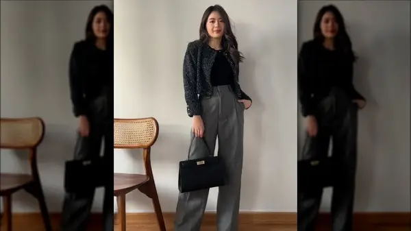 Woman holding purse and wearing black T-shirt