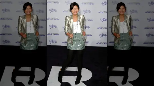 Zendaya smiling at the premiere of 