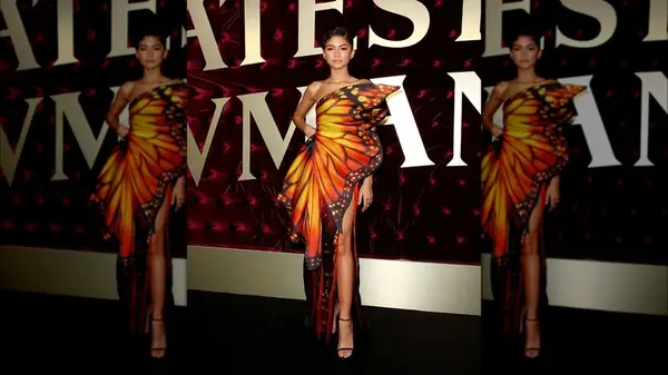 Zendaya posing with her hand on her hip at the premiere of 