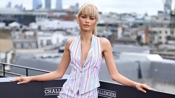 Zendaya posing against a city skyline for a 