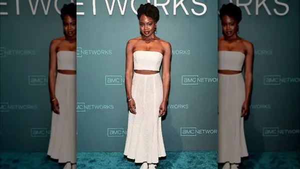 Danai Gurira in a tube top and skirt 