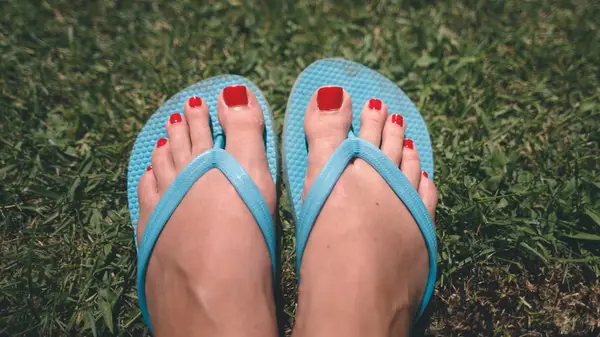 basic flip flops on pedicured feet