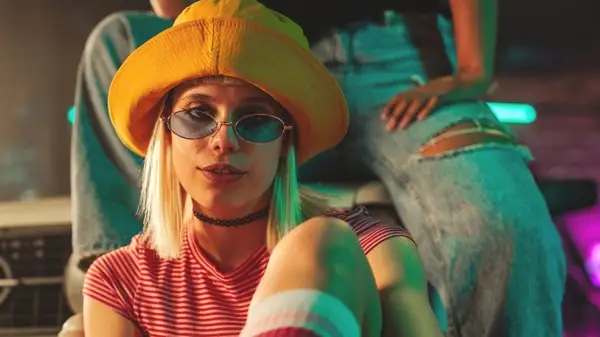 model in sunglasses and hat