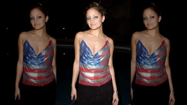 Nicole Richie in a chainmail top patterned like an American flag