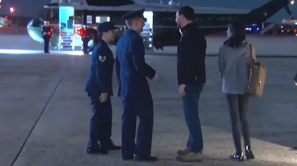 JD Vance and Usha Vance disembarking a plane