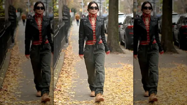 Emily Ratajkowski wearing a cropped leather jacket while walking in New York City