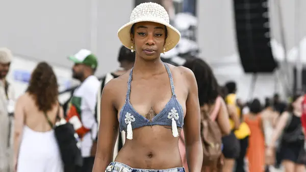 A woman wearing a denim bralette 