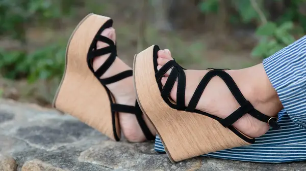 Black strappy wedge sandals with light wood wedge