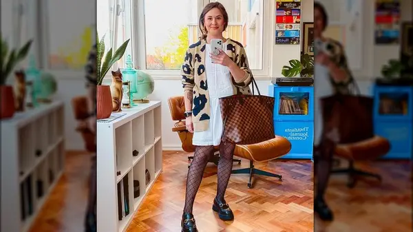 Fishnet tights worn with loafers