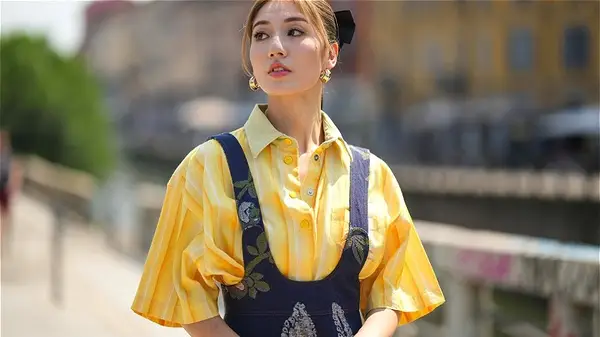 model in yellow striped shirt