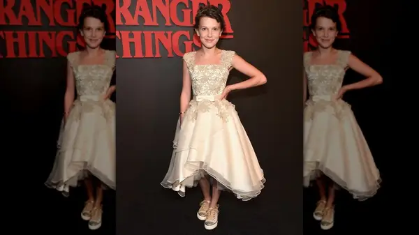 Millie Bobby Brown posing with a hand on her hip at the 2016 