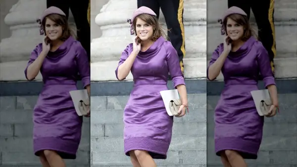 Princess Eugenue walking down the stairs and smiling in a purple dress