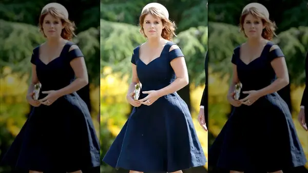 Princess Eugenie wearing a dark blue dress with shoulder cut outs