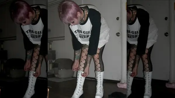 Person tying laces on boots