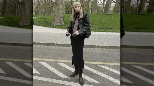 Person in skirt and tie