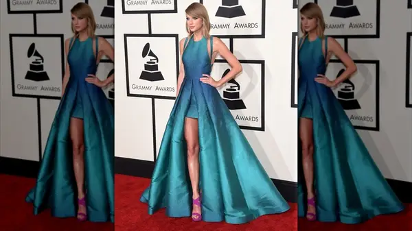 Taylor Swift on the red carpet in a blue gown