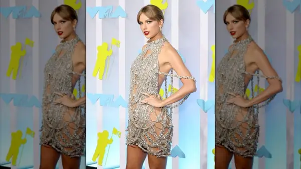 Taylor Swift on the red carpet in a dress made of crystal