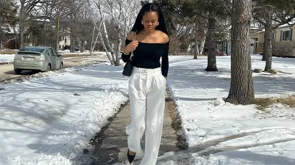 A woman in a black and white outfit