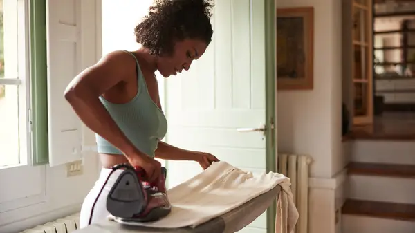 Woman ironing clothing