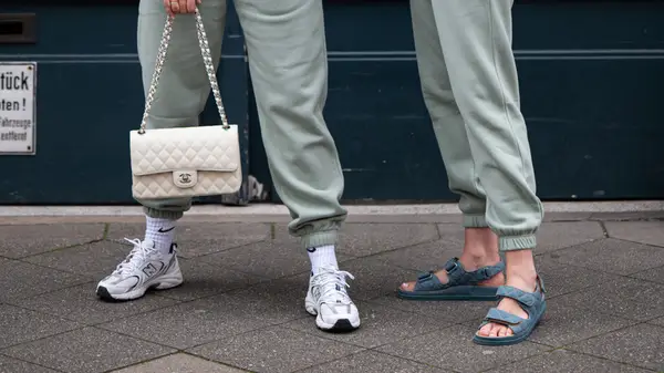 New Balances worn with Chanel purse