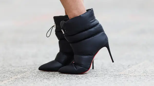 A woman wearing puffy boots 