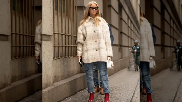 A woman in a cream colored shacket 