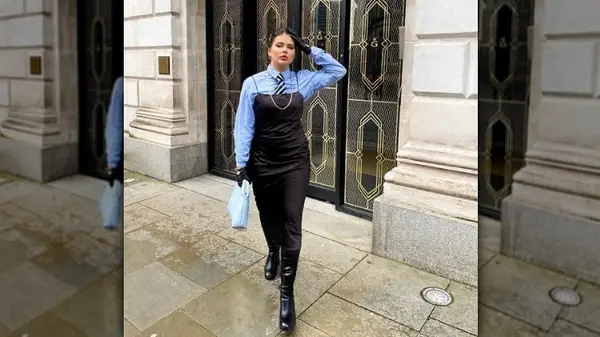 Woman in a dress and tie