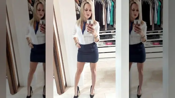 Woman in tie and miniskirt