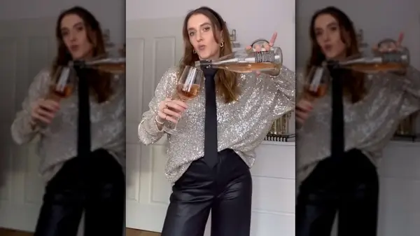 Woman in sequin top and tie