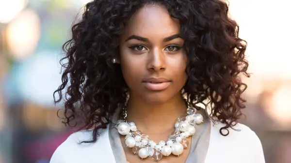 Woman wearing chunky necklace