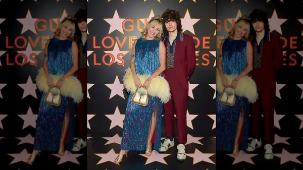 Miley Cyrus posing with Maxx Morando at the 2021 Gucci Love Parade