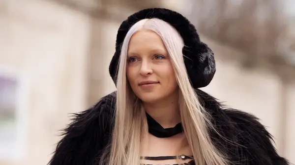 Woman in furry ear muffs 