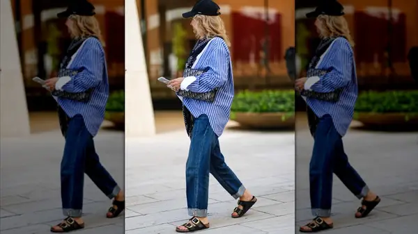 A guest attends NYFW for S/S 25 wearing the Arizona Big Buckle Sandals from Birkenstock