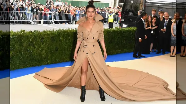 Priyanka Chopra posing at the 2017 Met Gala in a trench coat dress