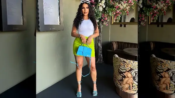 Woman with bright blue bag