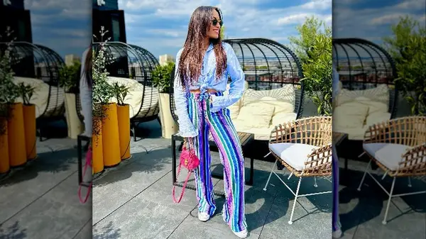 Woman in bright striped pants