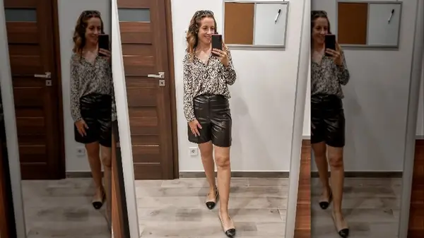 Woman in leather shorts
