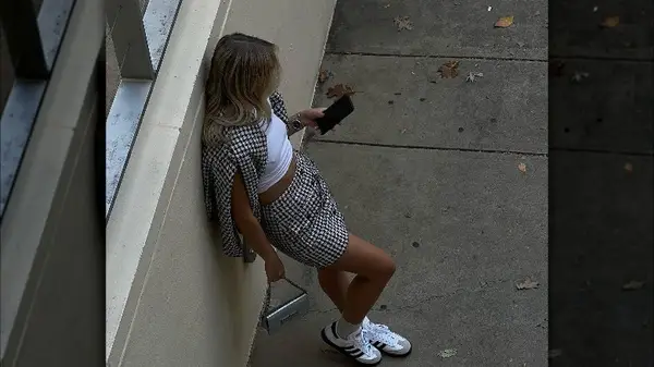 Fashion influence Anastasia Korol wearing Sambas with preppy outfit