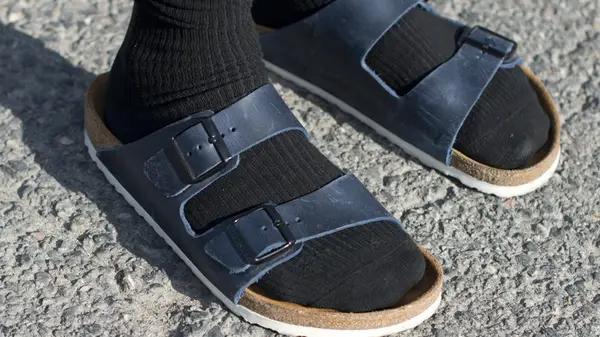 Blue Birkenstocks with black socks 