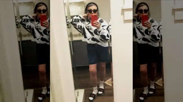 Woman wearing slides and socks