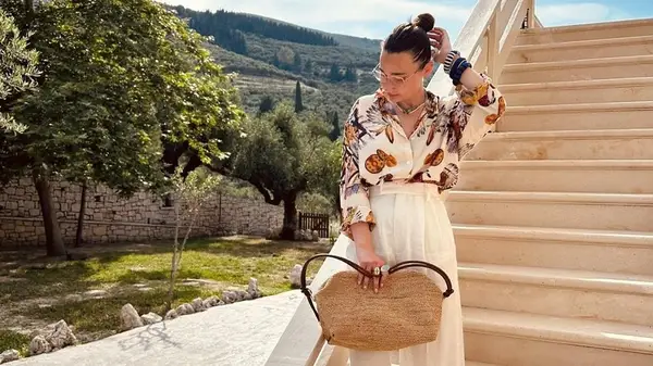 Woman with raffia handbag