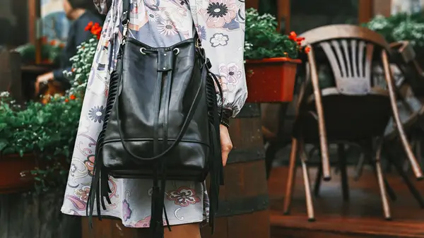 Woman with large bucket bag